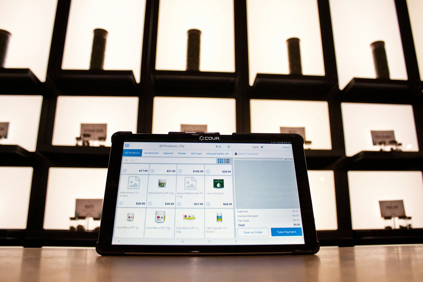 Tablet showing point-of-sale software on a counter.